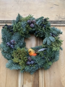 Fresh Spruce and foliage wreath with robin